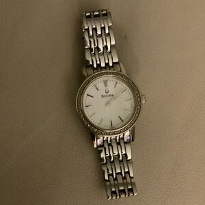 Bulova Womens 27mm silver bracelet watch with brand new battery installed. Works